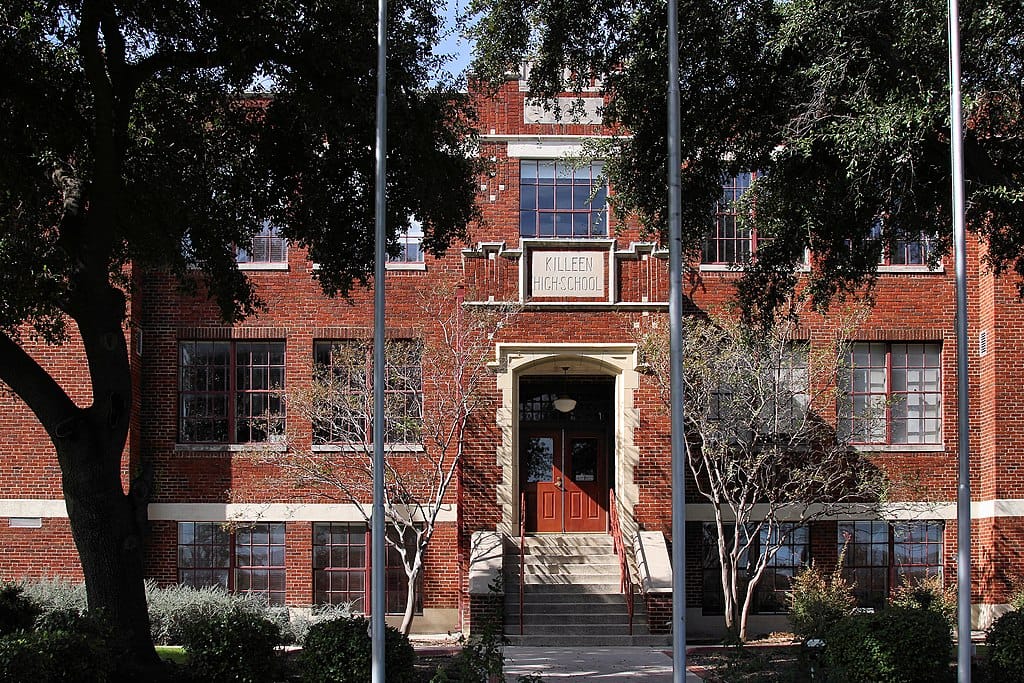 Historic Killeen High School building exterior with trees
