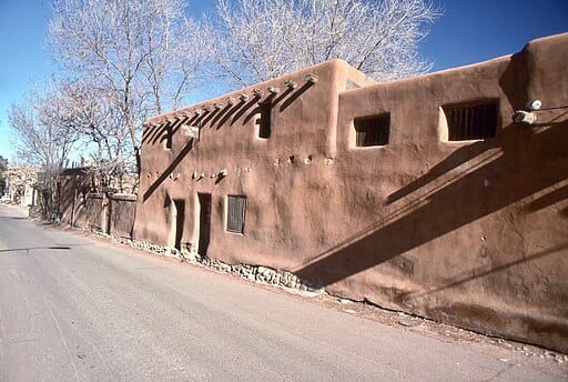 Adobe building in desert landscape