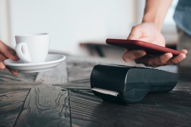 Contactless payment with phone at a café